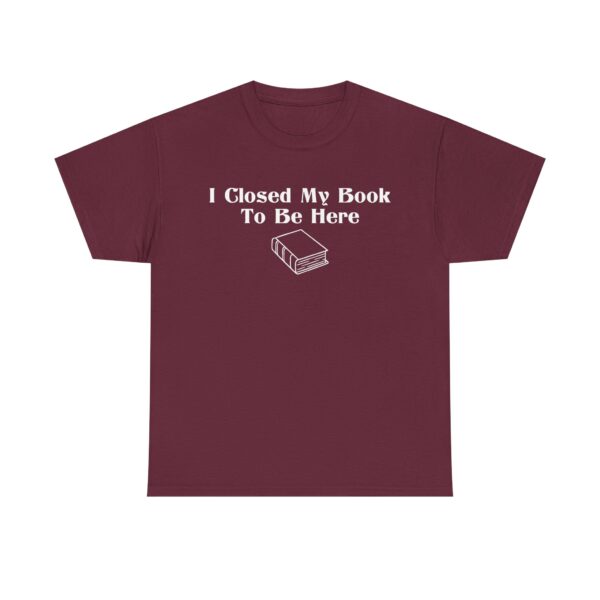 T-shirt with white text that says "I Closed My Book To Be Here" and a simple white graphic of a closed book below the text