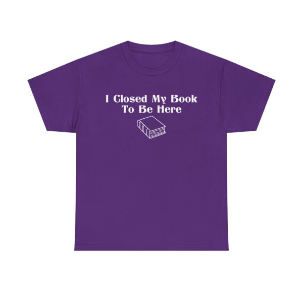 T-shirt with white text that says "I Closed My Book To Be Here" and a simple white graphic of a closed book below the text