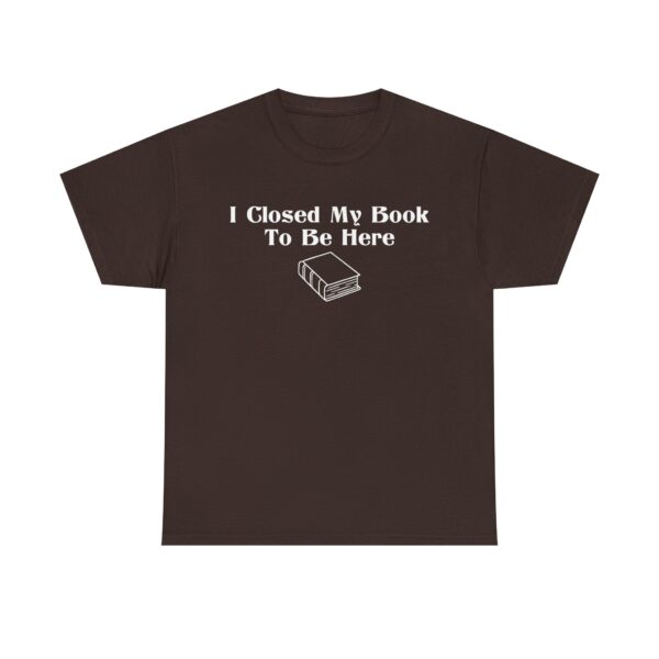 T-shirt with white text that says "I Closed My Book To Be Here" and a simple white graphic of a closed book below the text