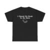T-shirt with white text that says "I Closed My Book To Be Here" and a simple white graphic of a closed book below the text