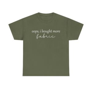 Funny t-shirt with the quote "Oops, I bought more fabric" in white script – perfect for fabric lovers and sewing enthusiasts.