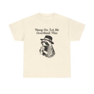 "Raccoon T-shirt design wearing a hat and holding a drink with the quote ‘Hang On, Let Me Overthink This.’"